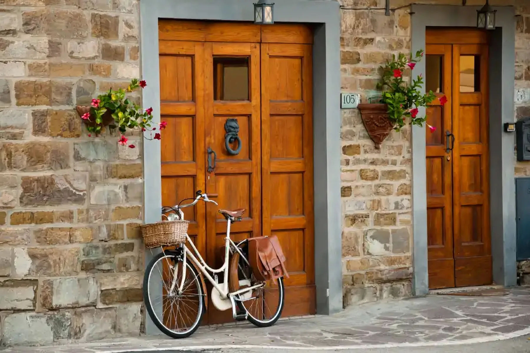 Wooden doors and a bicycle in a stone village