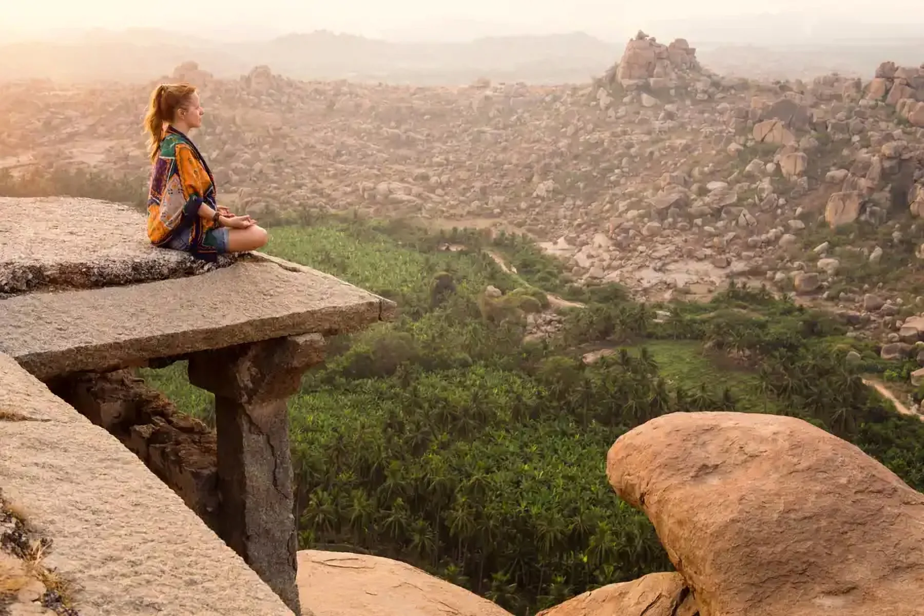 A traveller looking out over a rocky valley